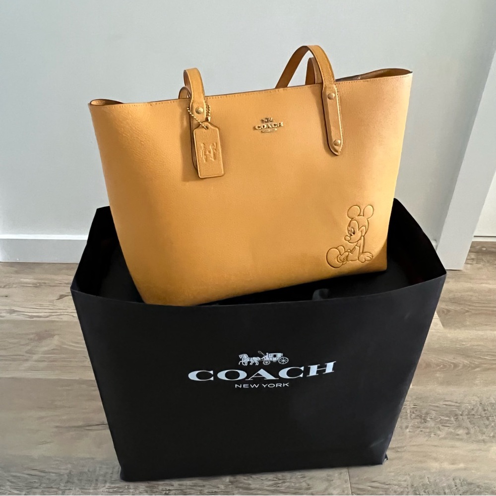 Disney X Coach Central Tote With Zip With Mickey Mouse
Buttercup Leather